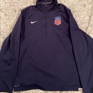 A navy blue USA Hockey quarter zip
